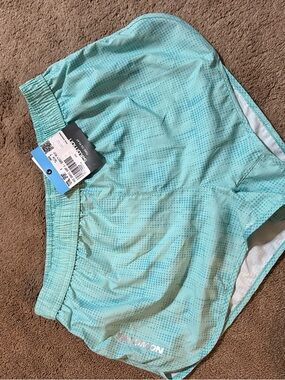 Salomon Teal Athletic Shorts with Subtle Dot Pattern